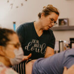 Doula of Belfast working on client's sacrum