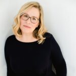 Doula of Belfast owner leaning against wall.