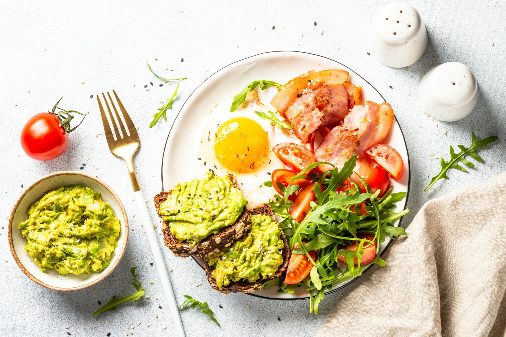 Healthy breakfast or lunch. Bacon, eggs and fresh salad.